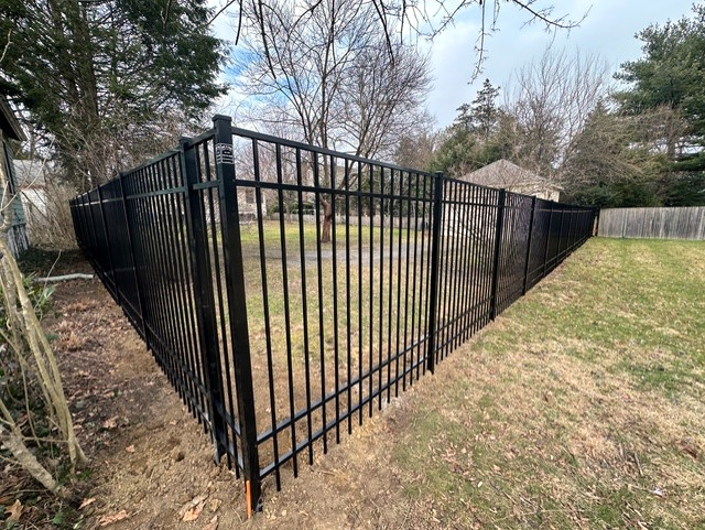A Durable, Four-Rail Jerith Legacy Fence Perfect for Pets and Privacy